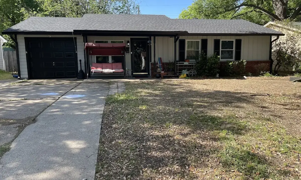 Wind Damage Roof Repair crew at work on a residential roof in Pascagoula
